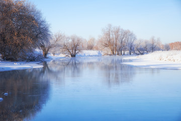 Naklejka na ściany i meble Freezing river Talitsa in winter