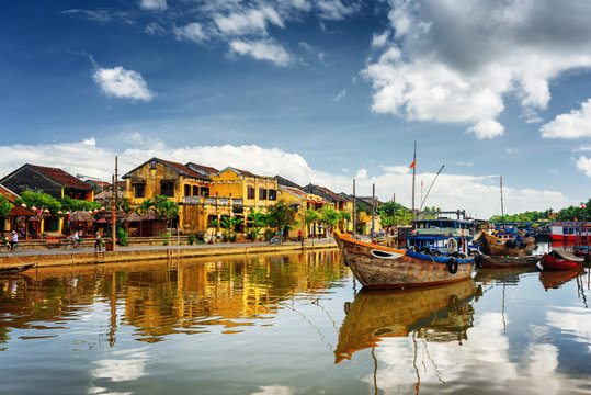 Wooden boats on the Thu Bon River in Hoi An, Vietnam
