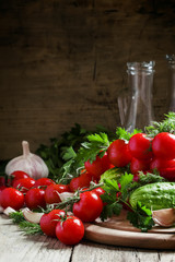 Fresh spring vegetables on a wooden cutting board, still life in