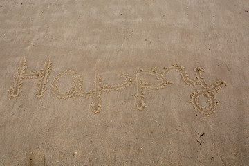 Happy writting in  a sand at summer