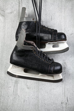 Old ice skates on wooden background