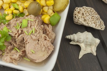 Tuna chunks with vegetables, preparing dietary meals. Fishing industry.
