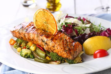salmon with salad on a white background
