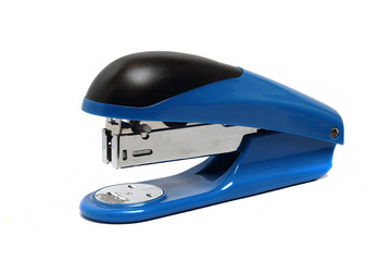 big blue office stapler on a white background