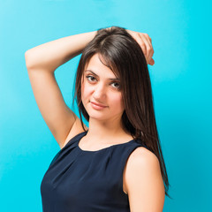 Fototapeta premium woman holding hand on head blue background