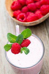 Raspberry milk shake with mint decor.