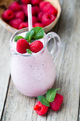 Raspberry milk shake with mint decor.