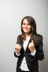 beautiful business woman holds fists