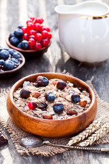 Healthy  breakfast with muesli and chocolate covered berries