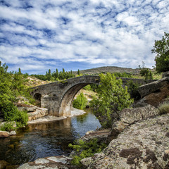 Fototapeta na wymiar Medieval bridge over the Alberche river, Sierra de Gredos, Spain
