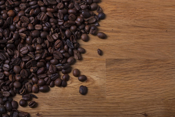 Nice coffee beans over an oak table