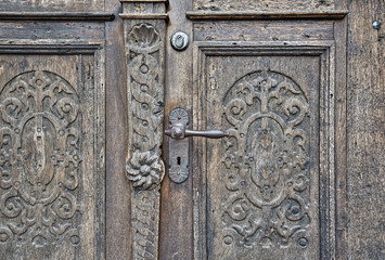 details of a old carved wooden door
