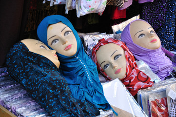 Heads of dolls for hijabs selling. Old Jerusalem market.
