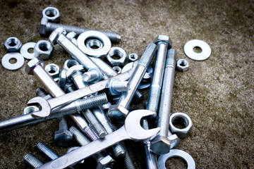 Screws, bolt, metal nuts, canvas, wrench to unscrew