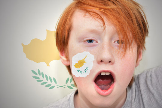 redhead fan boy with cypriot flag painted on his face