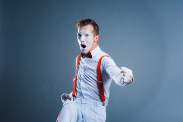  two funny mimes isolated on gray background
