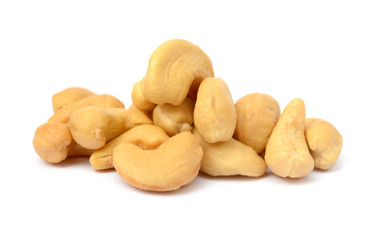Tasty salted cashew nuts on a white background