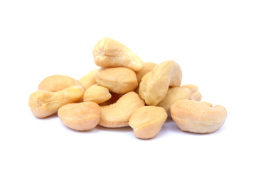 Tasty salted cashew nuts on a white background