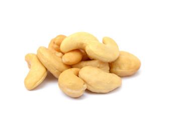 Tasty salted cashew nuts on a white background