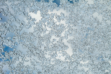 Ice on windows glass. Frost on the window. Window in Winter.