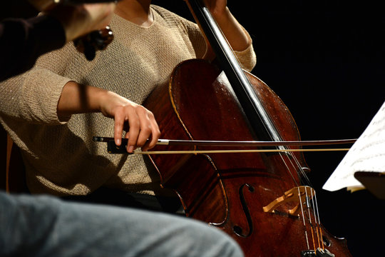 Classical musician playing the Cello during performance