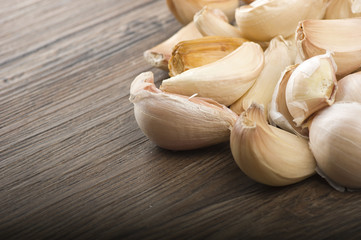 Group of garlic cloves on the wood