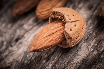 Tasty almond nuts rustic wooden background