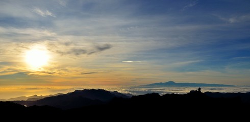 Sunset from the Canary islands with Roque Nublo and Tenerife island in background
