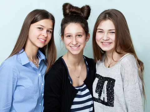  Close up portrait of three teenage girls smiling
