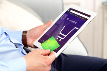 Man shopping online with digital tablet
