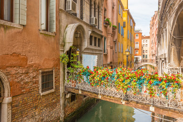 Lovely view on the bridge and the canal of Venice.