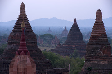 Pagoda under a warm sunset in the plain of Bagan, Myanmar (Burma)