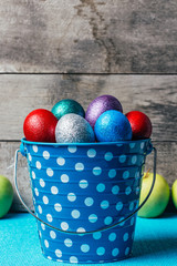 Easter Eggs In blue Tin Bucket