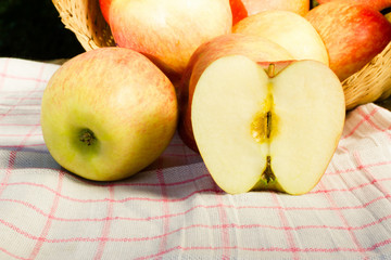 Fresh and colorful apples in basket, selective focus