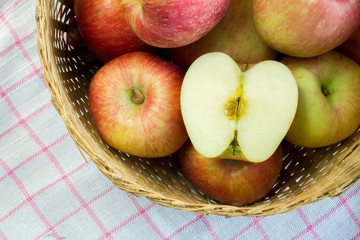 Fresh and colorful apples in basket, selective focus