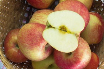 Fresh and colorful apples in basket, selective focus