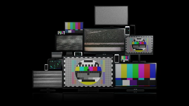 Many different types of screens. TVs, computer monitors, smartphones and tablets. They laid on each other in a pile isolated on a white background. They are all with no signal. With alpha and zoom in.