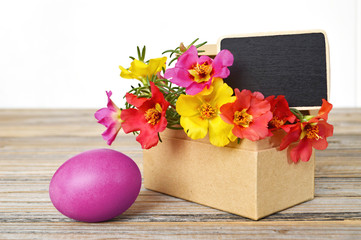  Easter flowers, pink Easter egg and blank miniature blackboard