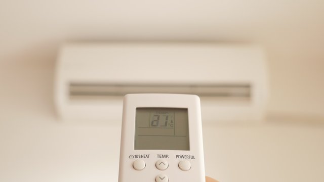 Split system air conditioner heating up with remote control 4K 2160p UltraHD footage - Air condition split system choosing higher temperatures 4K 3840X2160 UHD video