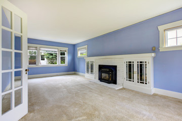 unfurnished room with periwinkle walls.