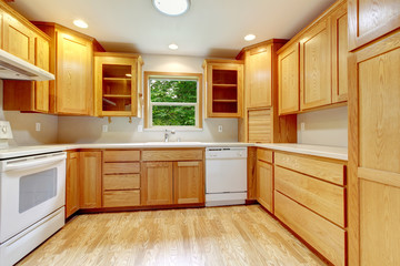 Simple kitchen with hardwood floor.