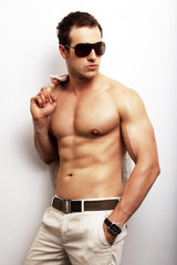 Sexy shirtless muscular guy posing fashion