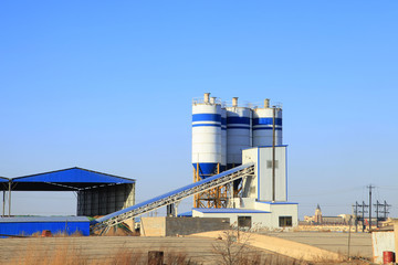 Obraz premium Concrete mixing tower. Concept of on-site construction facility.