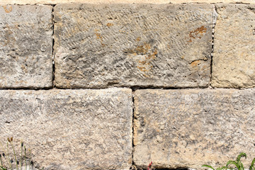 gray wall of stone blocks