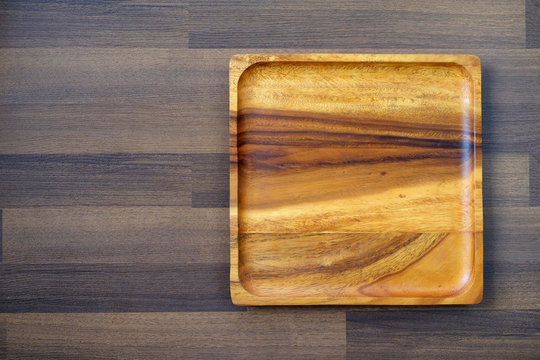 Empty wooden tray on table