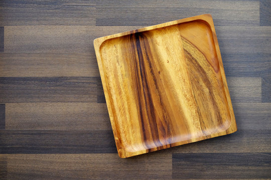 Empty wooden tray on table, food background