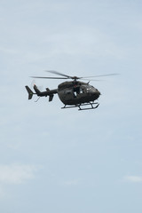 Fototapeta na wymiar UH-72A Lakota flies over head with doors open