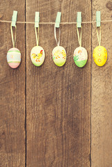 Line of eggs wooden wall. Happy easter