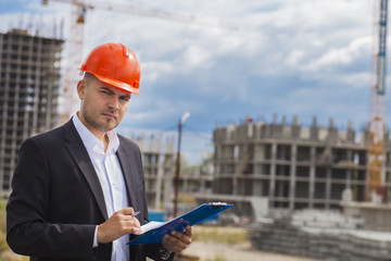 Worker inspector  in helmet checking  construction 