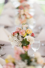 Obraz na płótnie Canvas Beautiful flowers as dining table decoration